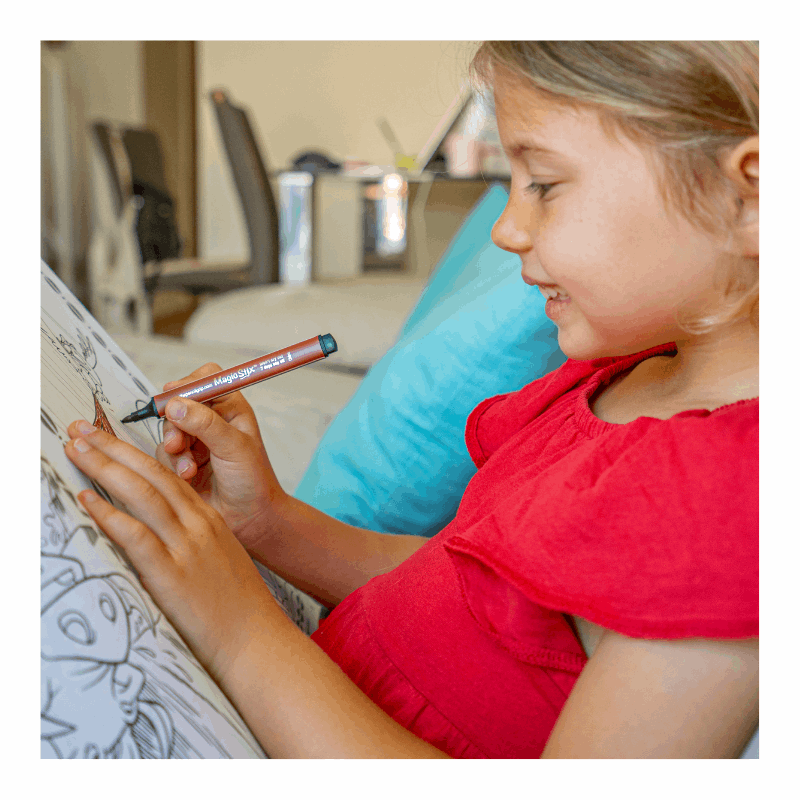 girl coloring with magic stix marker