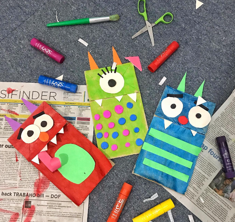 three halloween monsters made with painted brown paper bags