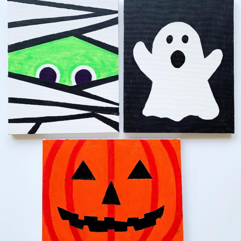 3 halloween themed canvas- one ghost, one pumpkin, and one mummy