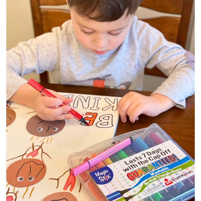 child drawing with magic stix