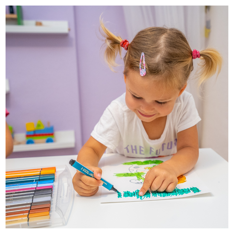 little girl drawing with magic stix
